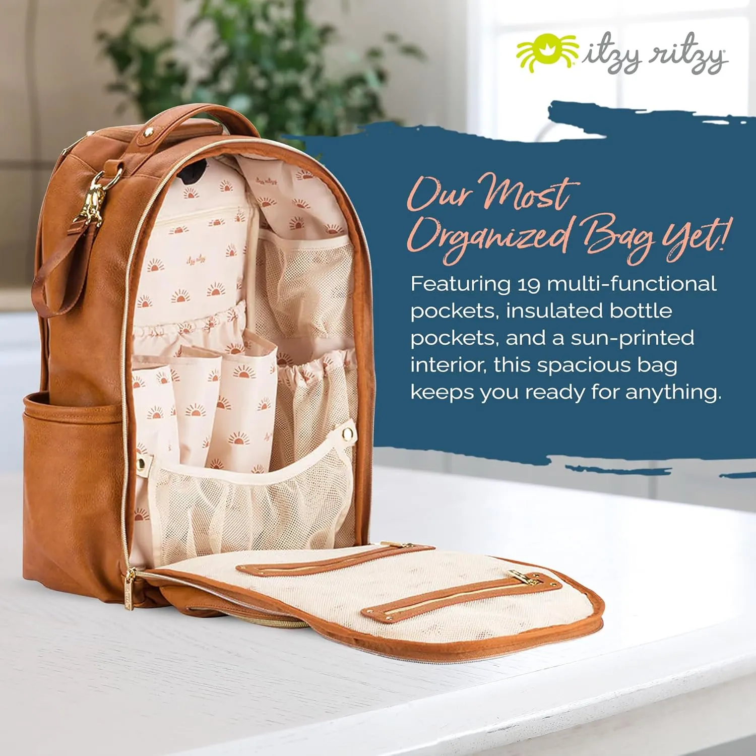 Itzy Ritzy Diaper Bag Backpack – Large Capacity Boss Plus Baby Backpack Diaper Bag Featuring 19 Pockets, Changing Pad, Stroller Clips, and Comfortable Backpack Straps, Cognac